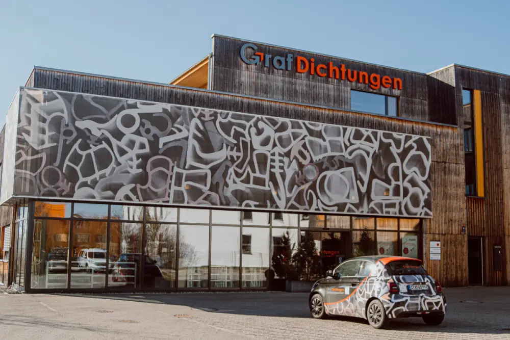 Bild vom Graf Dichtung Gebäude in München mit dem Firmenwagen